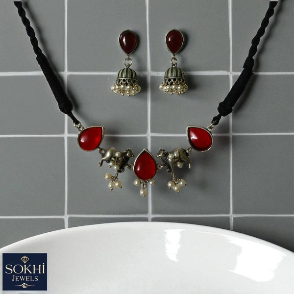 Sokhi Jewels Silver Replica Ethnic Elephant Charm Necklace & Earrings Set – Maroon Teardrop Stones with Pearl Drops on Braided Black Cord for Festive & Spiritual Wear for Women & Girls - Mojo