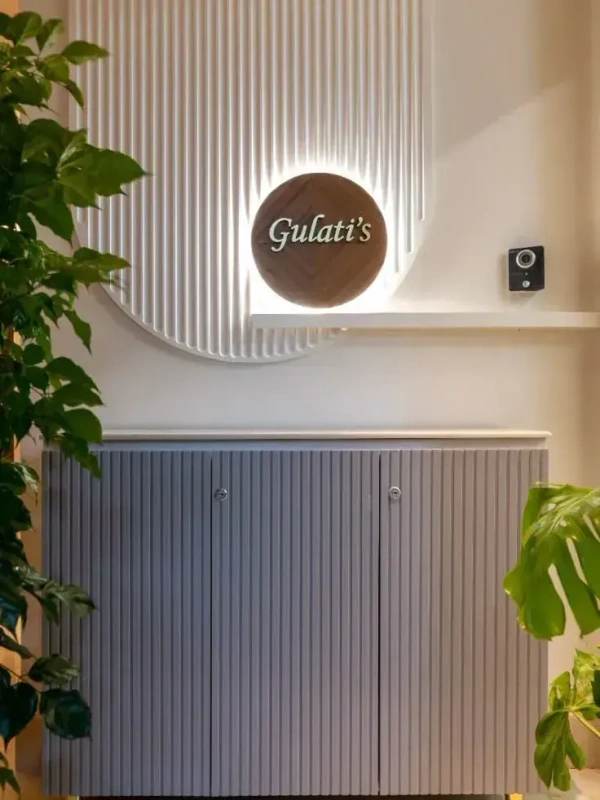 Modern Wooden Circular Nameplate on Fluted Backlit Panel