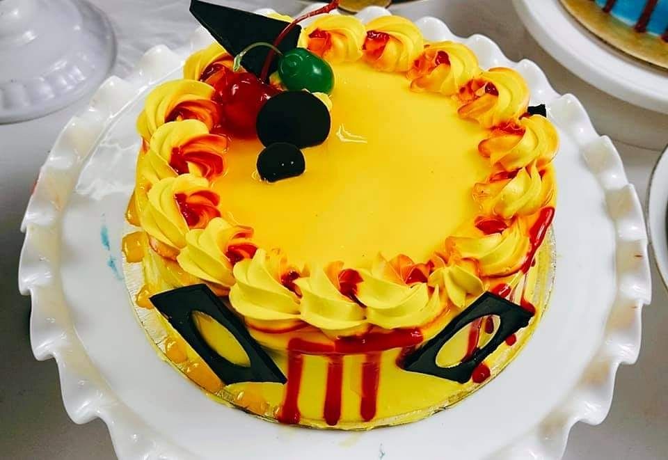 Order Bright and Delicious Mango Cake Online From KING BAKER'S N BIRTHDAY  DECOR'S,Muzaffarnagar
