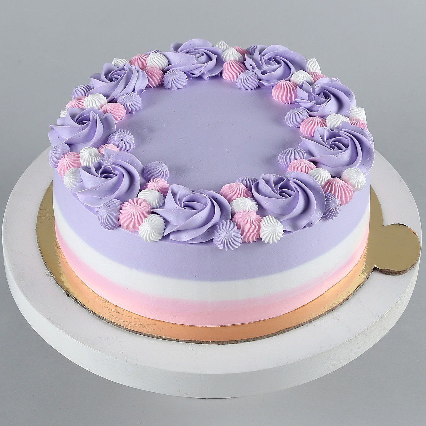 Close-up of unicorn cake with pink, blue, and purple colors and flowers.  Made for birthday Stock Photo | Adobe Stock